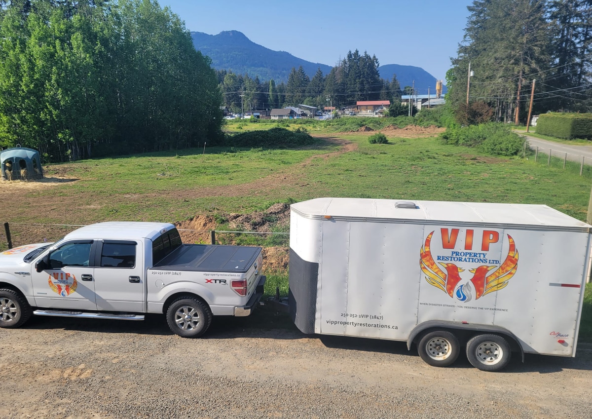 VIP Property Restorations' truck and trailer with Cowichan Valley & mountain backdrop