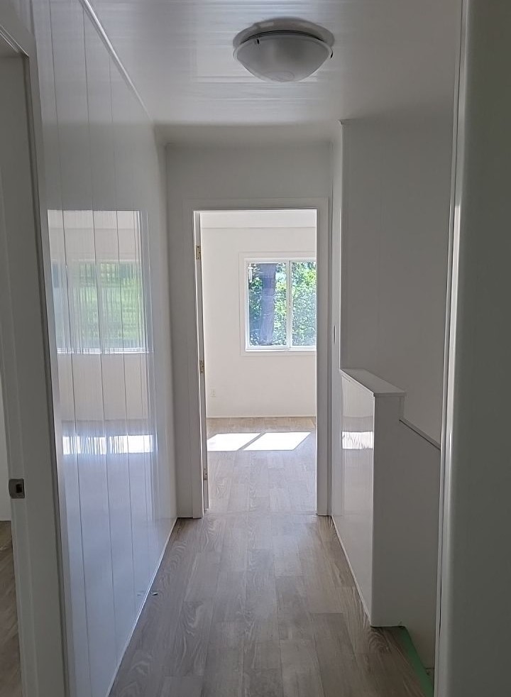 Trusscore installation by VIP Property Restorations in staircase landing of Cowichan Valley home