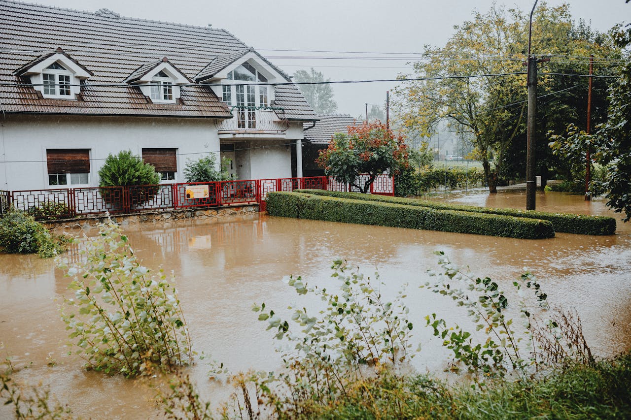 flooded yard outside home that caused interior property damage
