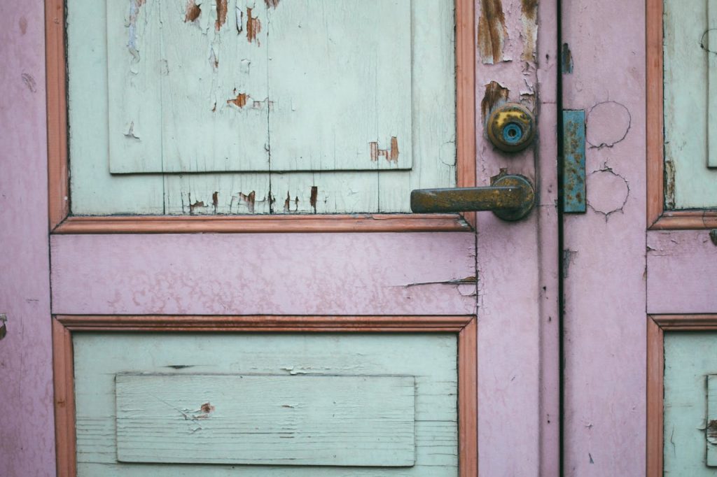 old wood door with flaking lead paint