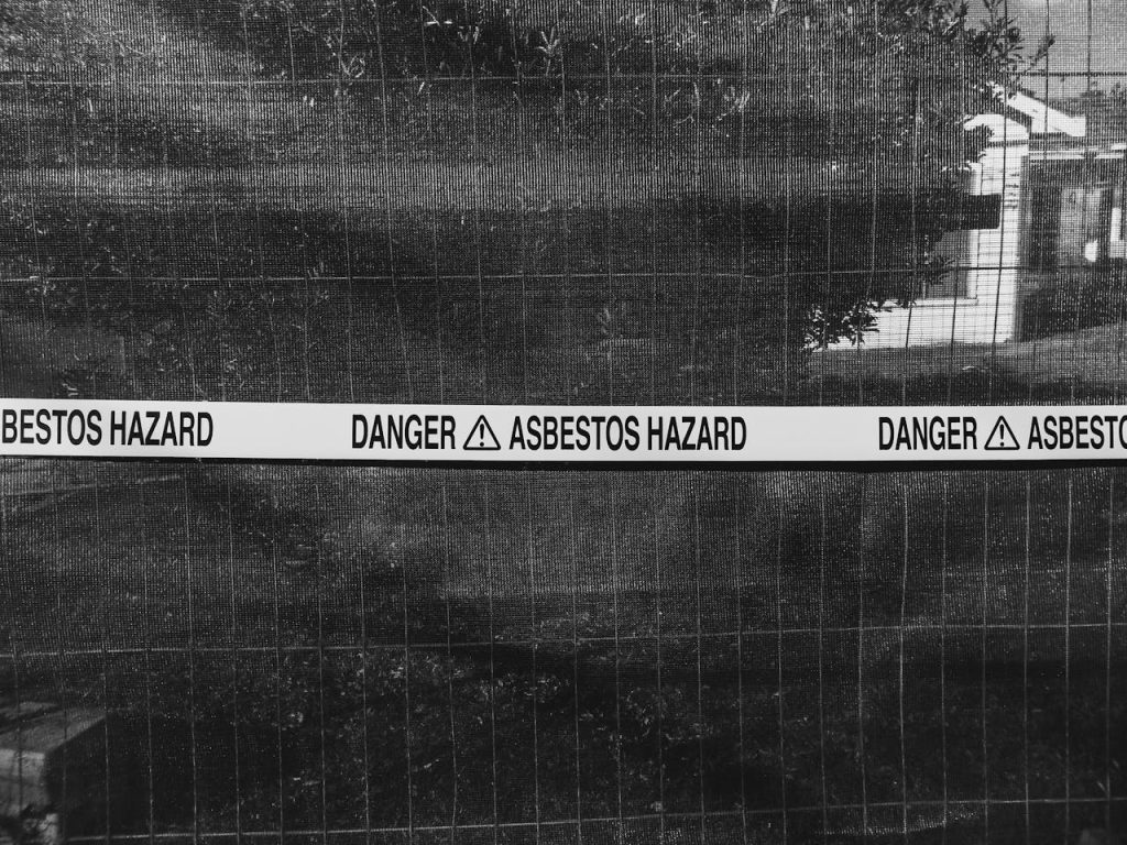 asbestos hazard tape over gated area